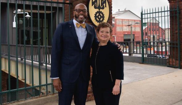 Photo of a man and a woman standing together.